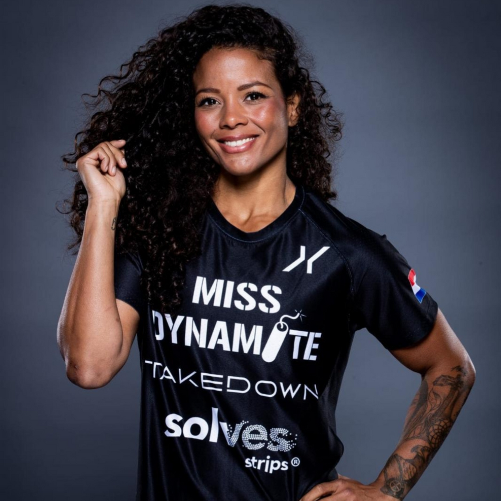 Solves Strips® in 'Miss Dynamite' Denise Kielholtz's Corner for Title Fight